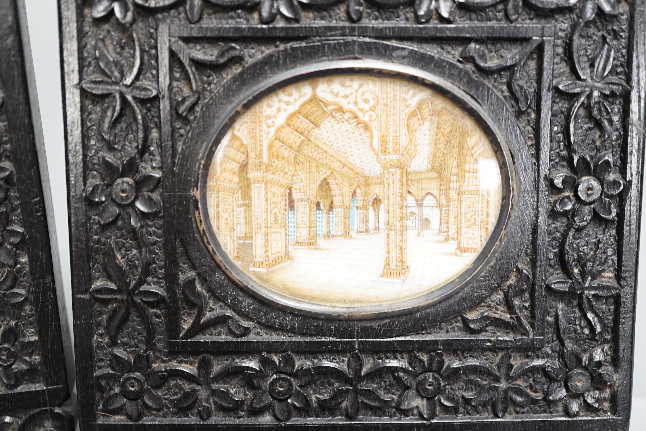 A pair of Indian miniatures on ivory, early 20th century, in ebony frames, 12 cm high